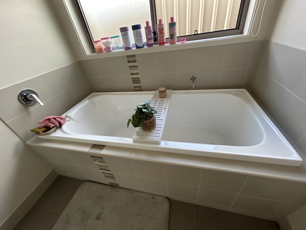 Deep cleaned white bathtub and tiles in modern bathroom – Albury NSW