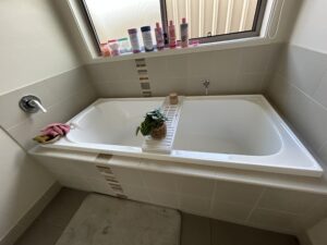 Deep cleaned white bathtub and tiles in modern bathroom – Albury NSW