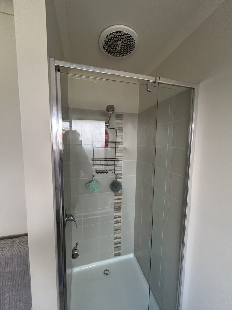Clean shower area with glass doors and wall tiles after bathroom deep clean – Albury NSW