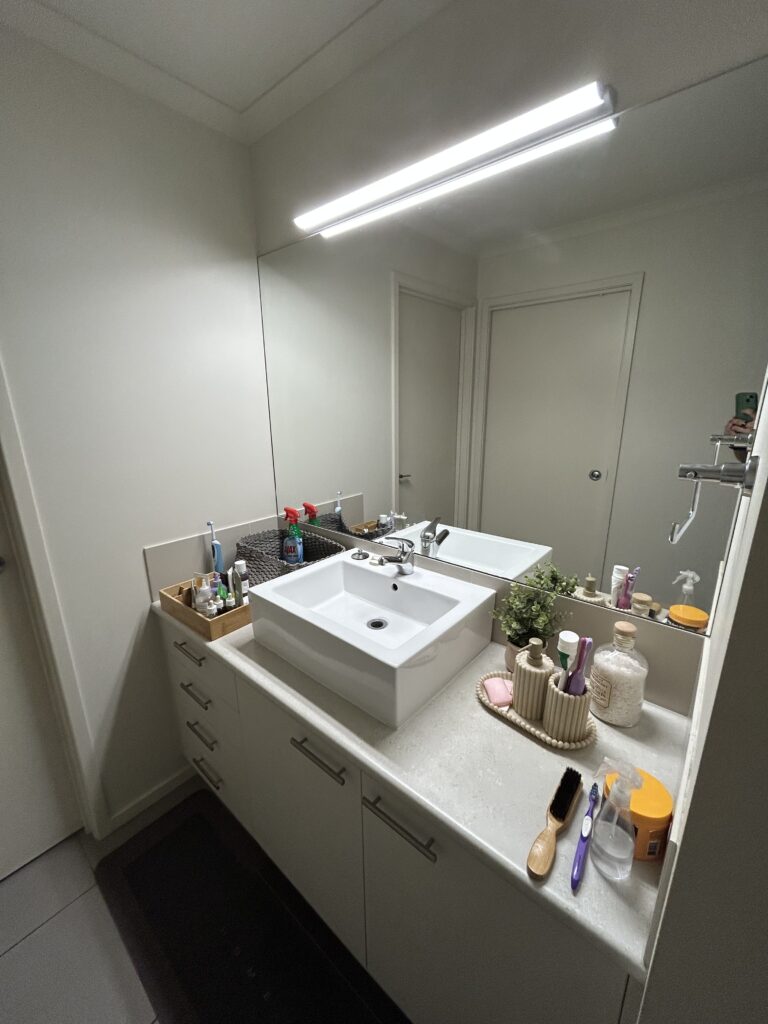 Bathroom sink, vanity and mirror after professional cleaning – Albury NSW