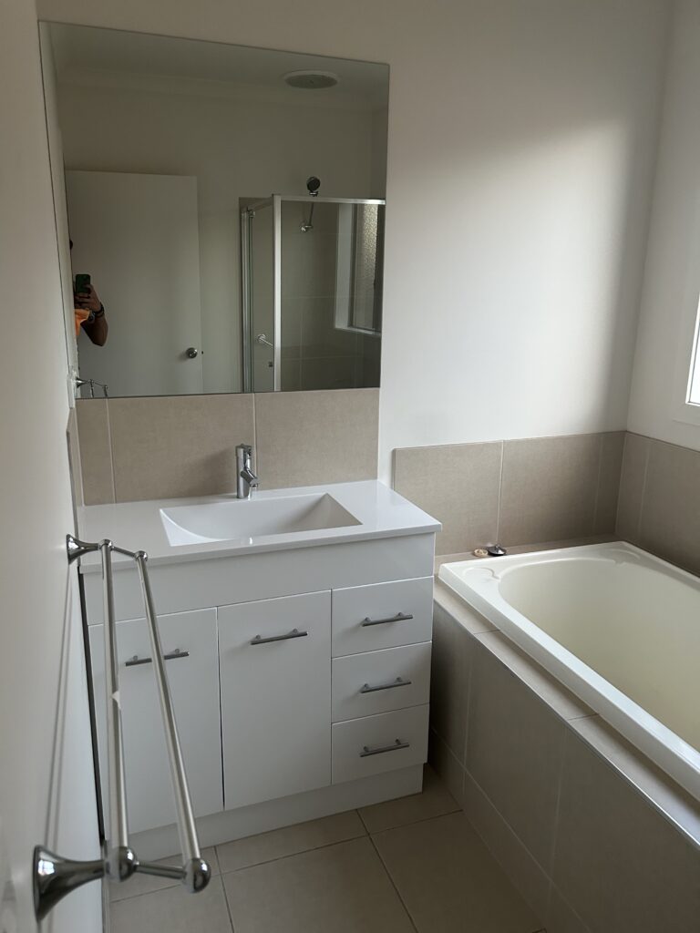 Bathroom with vanity, mirror and bathtub professionally cleaned – Wodonga VIC